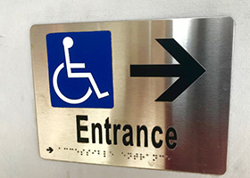 ADA entrance sign of wheelchair made by Envision Orlando