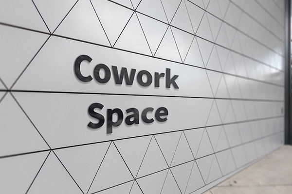 Crowded Space lobby sign designed by Envision Orlando